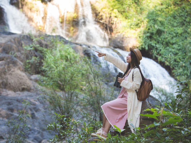 Female tourists are walking on nature.